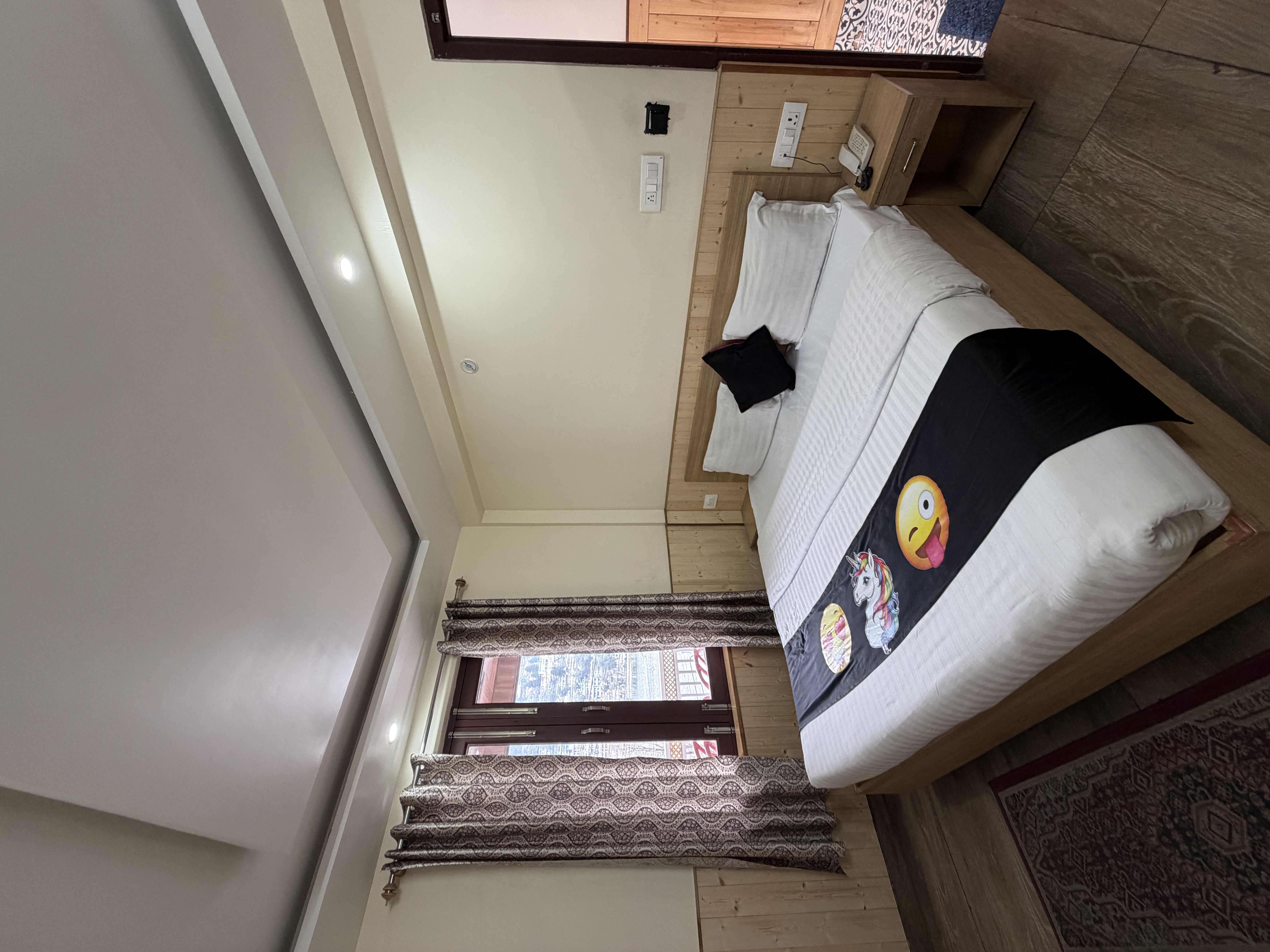Cosy hotel room with clean bed and window